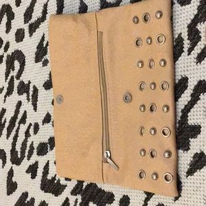 It is a tan purse